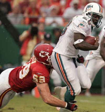 Associated PressFormer Eastern Washington tailback Jesse Chatman breaks a tackle in Miami's preseason win over Kansas City Thursday.
(Associated Press / The Spokesman-Review)