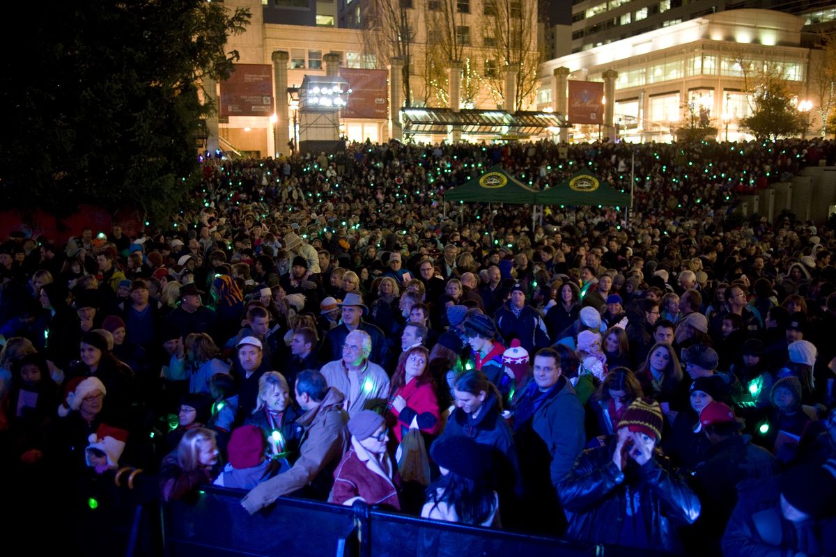 A crowd watches before a Christmas tree is lit on Pioneer Courthouse square in Portland in 2010. (Associated Press)