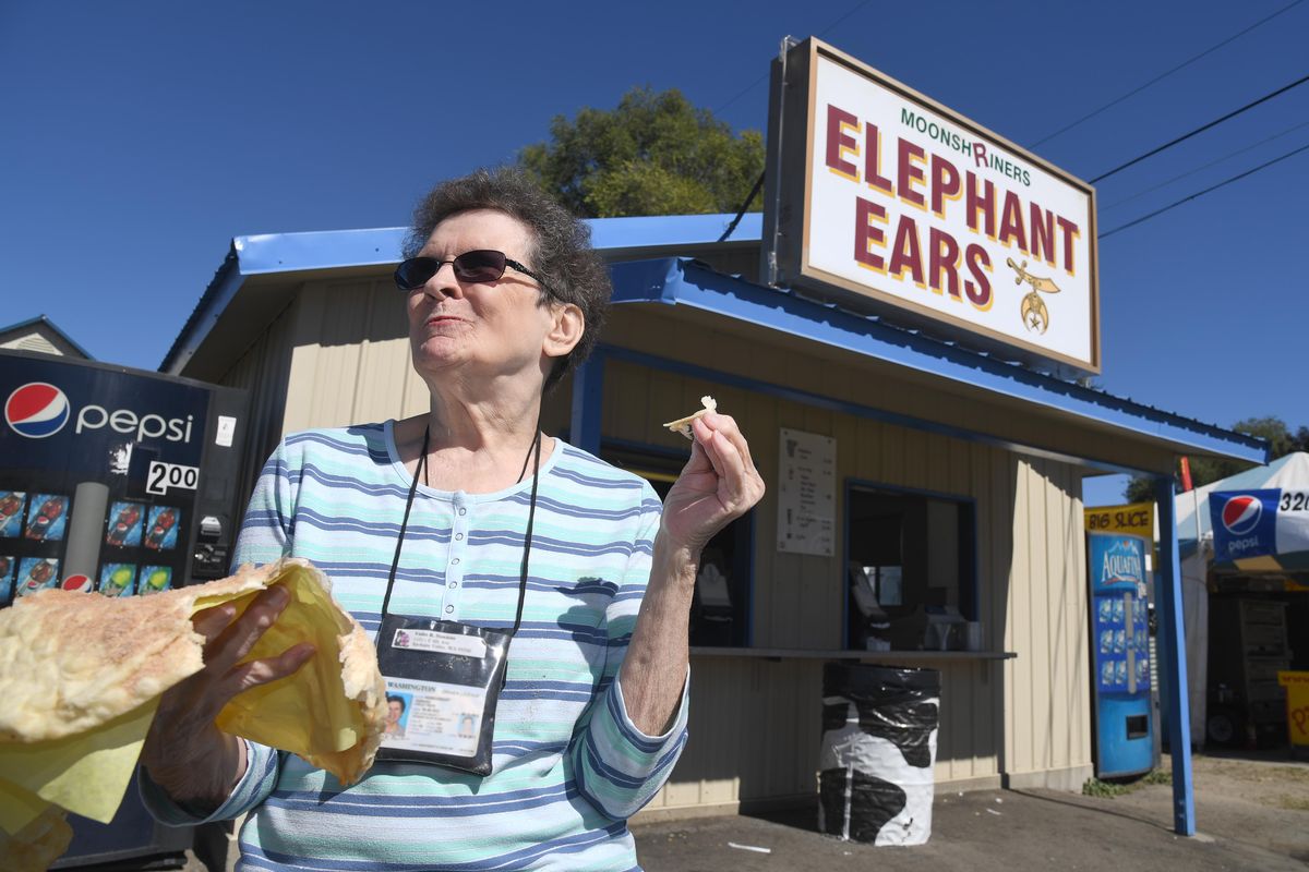 Violet Hawkins, 83, munches on an elephant ear from the Shriners
