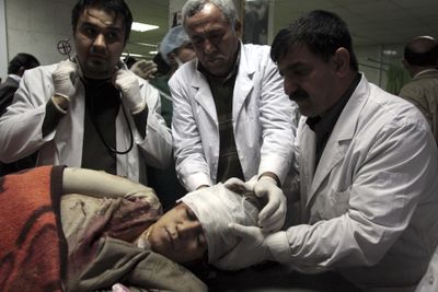 Medics treat a woman wounded in a suicide bombing in Kirkuk at a hospital in Sulaimaniyah, Iraq. (Associated Press / The Spokesman-Review)