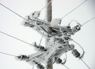 Ice buildup caused by heavy fog has triggered a  series of power outages in northern Lincoln County since last week. The ice has weighed down lines and poles. Photo courtesy of Inland Power and Light (Photo courtesy of Inland Power and Light / The Spokesman-Review)