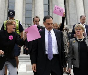 In this Oct. 6, 2008 file photo, Lehman Brothers Holdings Inc. Chief Executive Richard S. Fuld Jr., front center, is heckled by protesters as he leaves Capitol Hill in Washington after testify before the House Oversight and Government Reform Committee on the collapse of Lehman Brothers. (AP Photo/Susan Walsh, file) (AP file photo)