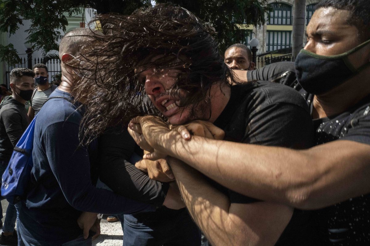Plainclothes police detain an anti-government protester during a protest in Havana, Cuba, Sunday, July 11, 2021. Hundreds of demonstrators went out to the streets in several cities in Cuba to protest against ongoing food shortages and high prices of foodstuffs, amid the new coronavirus crisis.  (Ramon Espinosa)