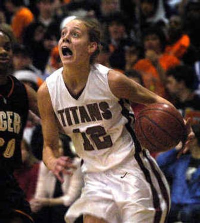 
University High sophomore Angie Bjorklund had 16 of her game-high 23 points in the second half as the Titans won their showdown with LC. 
 (Jed Conklin / The Spokesman-Review)