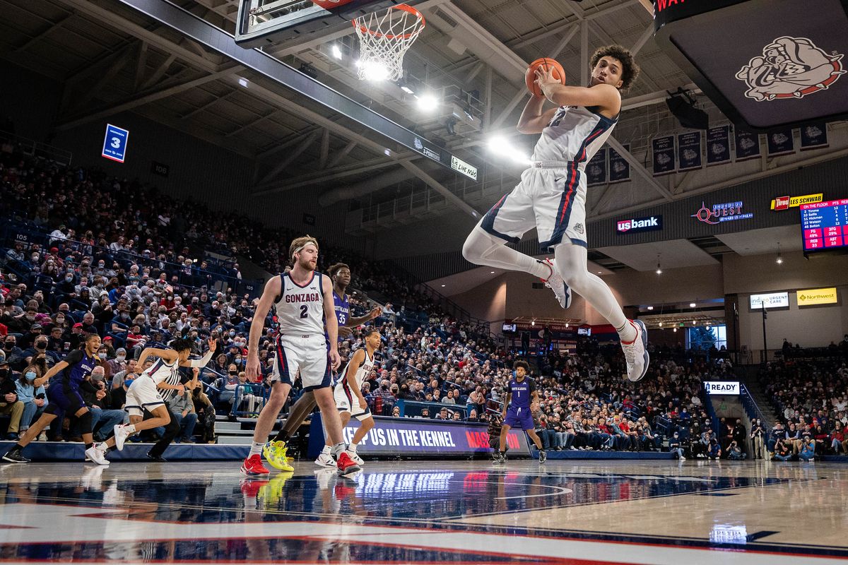 Gonzaga forward Anton Watson (22) grabs a rebound during the second half of a NCAA college basketball game, Tuesday, Dec. 28, 2021, in the McCarthey Athletic Center. Watson was game MVP with 10 points and 10 rebounds.  (COLIN MULVANY/THE SPOKESMAN-REVIEW)