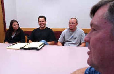
Members of the newly formed North Idaho College Young Republicans club, shown from left, are AshLee Strong; Vinny Zito, president of the club; and Tyrel Melvin. They are shown during a meeting conducted on Monday with their club adviser, Tad Leach, seated at front, also attending.
 (Kathy Plonka / The Spokesman-Review)