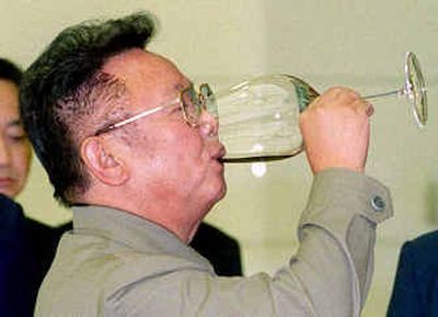 
 North Korean leader Kim Jong Il could be toasting the remaining remnants of his former pompadour haircut. 
 (File/Associated Press / The Spokesman-Review)
