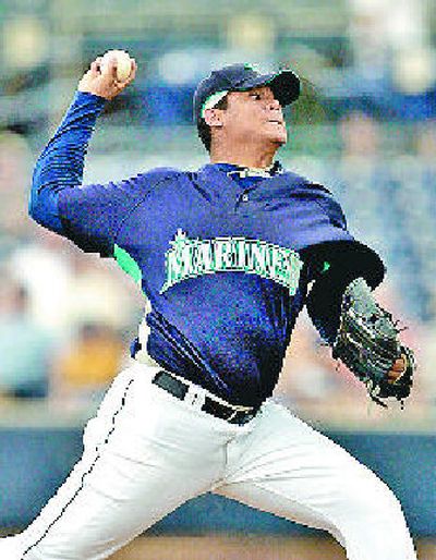 Mariners starting pitcher Felix Hernandez bears down against Giants. 
 (Associated Press / The Spokesman-Review)