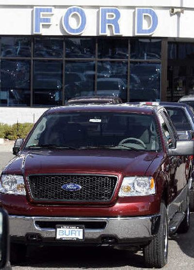 
A 2007 Ford F-150 pickup truck sits on the lot of a Ford dealership in the southeast Denver suburb of Centennial, Colo. 
 (Associated Press / The Spokesman-Review)