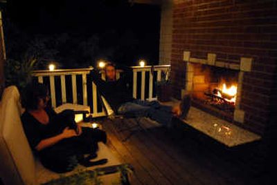 
Scott and Cheri Baker relax by their new outdoor fireplace with the family dog, George.
 (Photos by Jed Conklin/ / The Spokesman-Review)