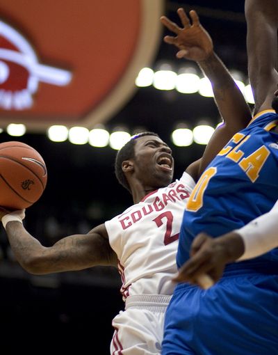 WSU’s Mike Ladd has tried different wraps on his injured right hand in order to keep playing. (Associated Press)