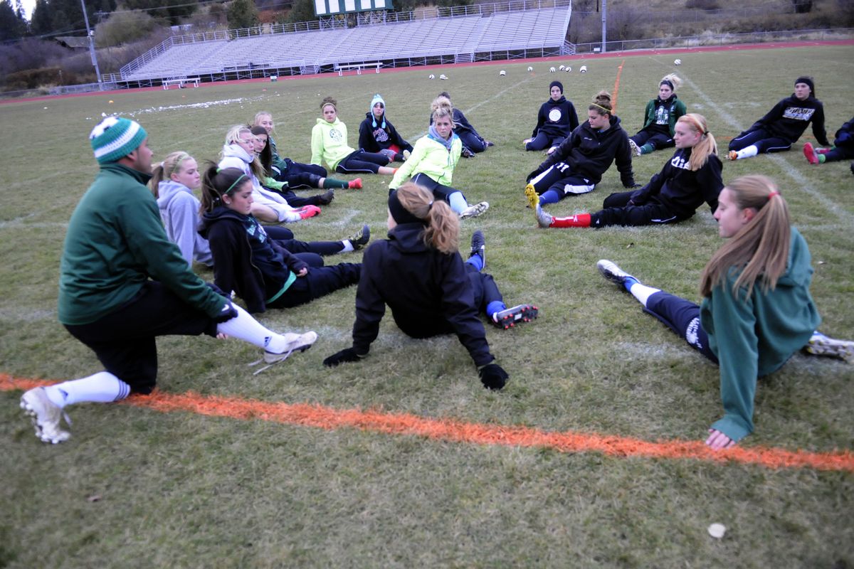 East Valley soccer coach Gabe Escobar talks to his team while they stretch before practice on Nov. 14. The Knights, led by captains McKaylin Hughes, Amanda Bleisner and Kendra Morscheck, finished the season with a State 2A final four appearance for the second consecutive year. (J. Bart Rayniak)