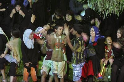 Shiite pilgrims celebrate Saturday night in Karbala, Iraq. The Shabaniyah festival in Karbala ends   this weekend.  (Associated Press / The Spokesman-Review)