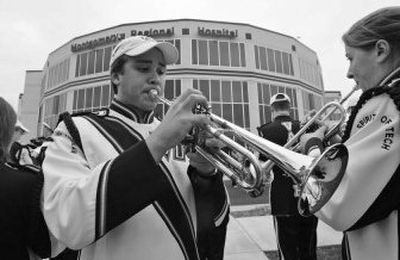 
Members of the Virginia Tech marching band tune up as they prepare to serenade shooting victims at the Montgomery Regional Hospital in Blacksburg, Va., Thursday. 
 (Associated Press / The Spokesman-Review)