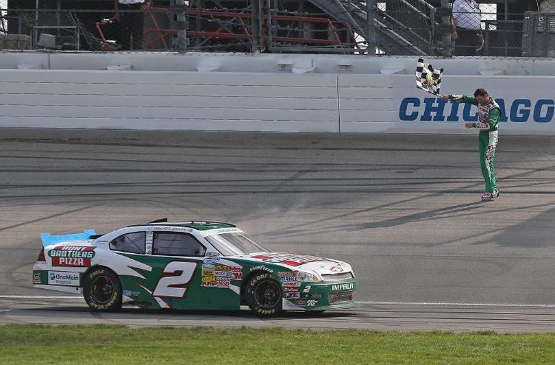 Elliott Sadler, driver of the #2 Hunt Brothers Pizza Chevrolet, waves the checkered flag after winning the NASCAR Nationwide Series STP 300 at Chicagoland Speedway on July 22, 2012, in Joliet, Ill. (Photo Credit: Jonathan Daniel/Getty Images) (Jonathan Daniel / Getty Images North America)