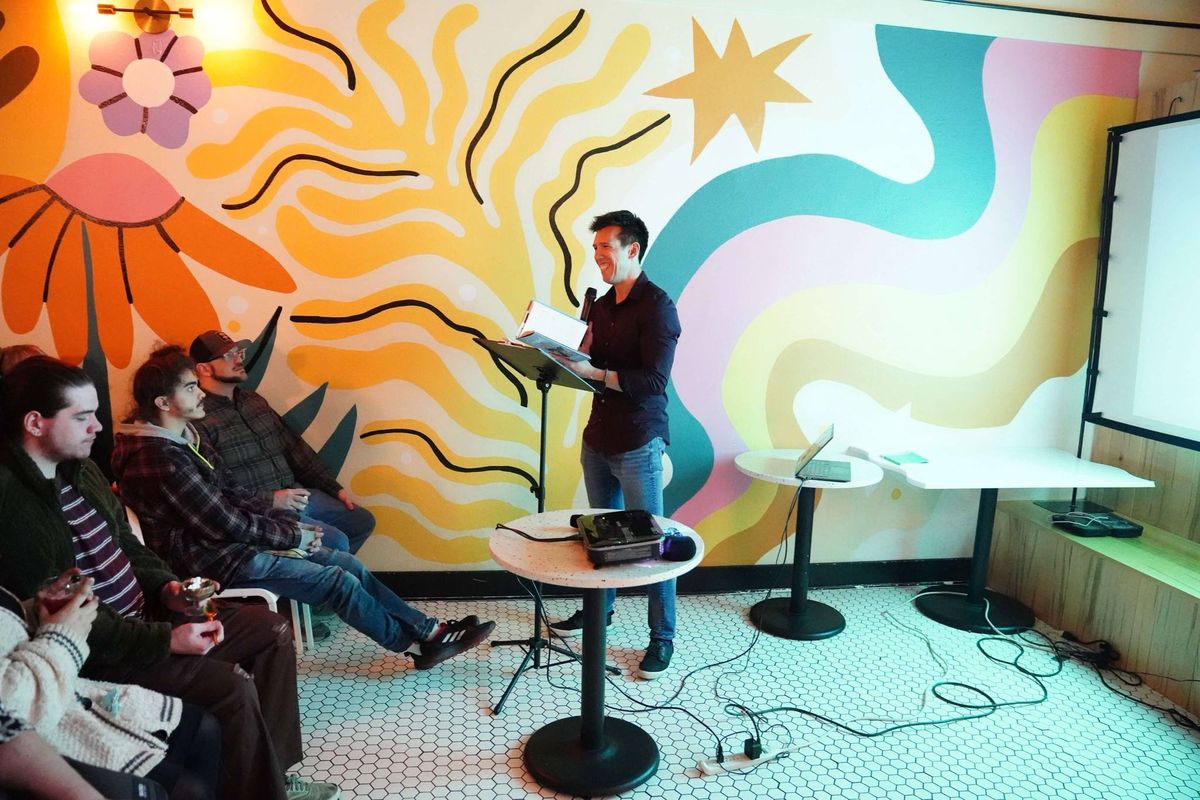 Daniel Tam-Claiborne reads his debut novel “Transplants” to an April crowd at People’s Waffle in downtown Spokane. (Courtesy of Greg Bem)