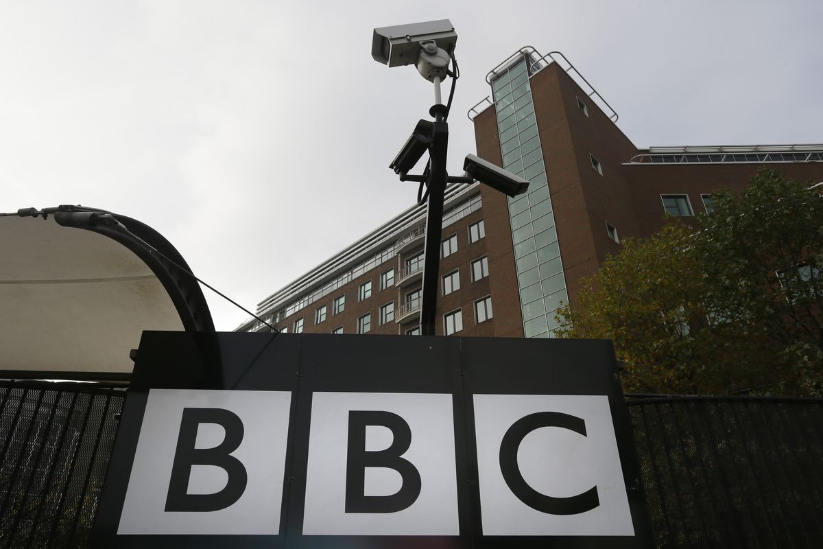 Cameras are seen above a sign at the BBC Television Centre, in London Wednesday, Oct. 24, 2012. The BBC is facing questions over sexual abuse allegations against former television presenter Jimmy Savile. (Kirsty Wigglesworth / Associated Press)