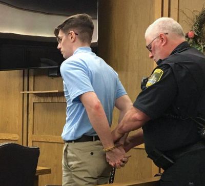 A corrections deputy handcuffs 24-year-old John A. Radavich following closing arguments in this photo from his August trial for first-degree murder. A jury convicted Radavich and a judge on Friday sentenced him to life in prison. (THOMAS CLOUSE / SR)