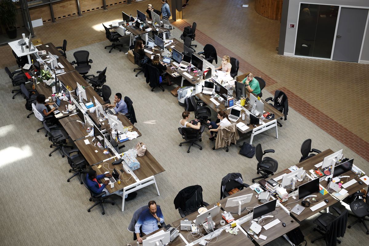 Employees are seen working at Shopify Inc.’s Shopify Plus in September 2018 in Waterloo, Ontario.  (Cole Burston/Bloomberg)