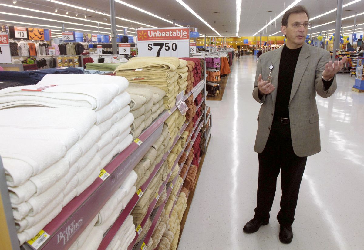 Associated Press photos Joe Tapper, vice president of in-store presentation for Wal-Mart Stores, Inc., talks about design changes made to shelving at Wal-Mart Store No. 1 in Rogers, Ark. (Associated Press photos / The Spokesman-Review)