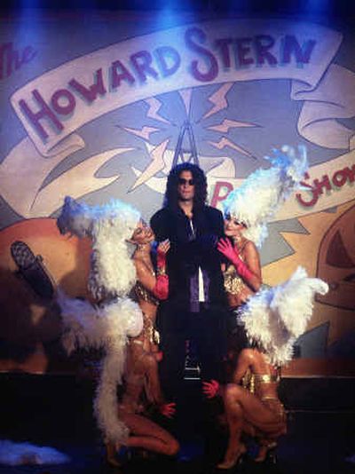 
Howard Stern is surrounded by showgirls during a taping of the 