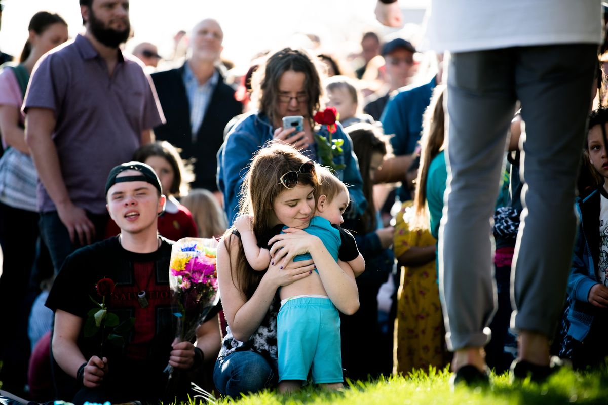 Whitney Hansen, center, embraces her son, Sam, while worshipping during a protest rally and church service led by The Church at Planned Parenthood on Wednesday at Planned Parenthood’s offices at 123 E. Indiana Ave. in Spokane. (Tyler Tjomsland / The Spokesman-Review)