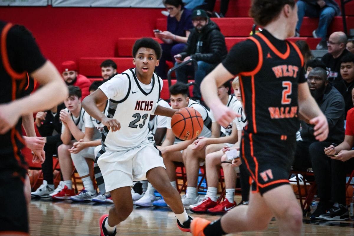 North Central guard Miles Spencer (23) dribbles the ball during the first half of a high school basketball game with West Valley, Friday, Jan. 30, 2026, at North Central High School.  (Colin Mulvany/The Spokesman-Revi)