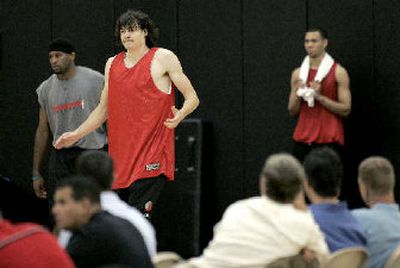 Former Gonzaga star Adam Morrison shrugs off a missed shot while working out in front of the Portland Trail Blazers.
 (Christopher Onstott / The Spokesman-Review)