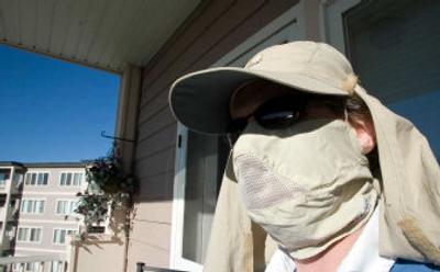 
David McRae wears protective clothing in Kenmore, Wash. McRae has porphyria, a rare condition that makes him extremely sensitive to light, and will get sunburns after short stints in the sun. He is fighting for a bill in Olympia that would add porphyria to the list of disabilities protected under handicapped parking. 
 (Associated Press / The Spokesman-Review)