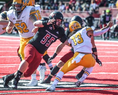 Eastern Washington linebacker Joshua Jerome closes in on Idaho quarterback Zach Borisch during Saturday’s game in Cheney.  (DAN PELLE/THE SPOKESMAN-REVIEW)