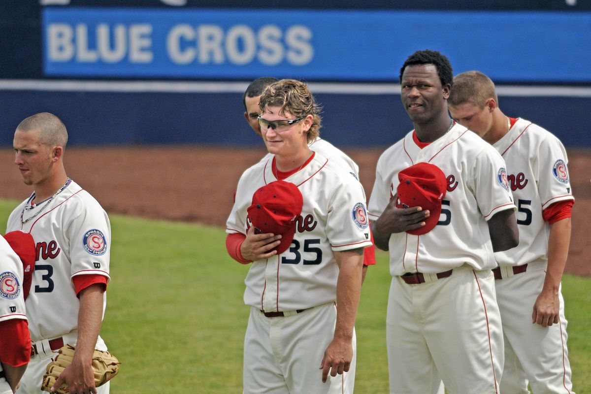 Spokane Indians reliever Matt West (35) stands for the national anthem with the rest of the bullpen before the game against Vancouver at Avista Stadium in Spokane, Wash., Monday, July 11, 2011. (Christopher Anderson / Spokesman-Review)