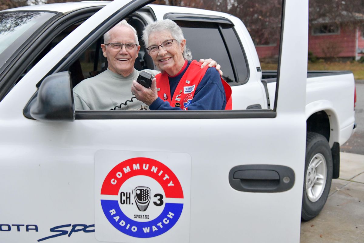 Delbert Winnett, left, and his wife Deb pose for a photo with one of their CB equipped vehicles on Wednesday, November 13, 2019, at their home in Spokane Valley, Wash. The couple – whose call-signs are LTD and Blue Mist, respectively – have been involved in Community Radio Watch since the late ’70s. (Tyler Tjomsland / The Spokesman-Review)