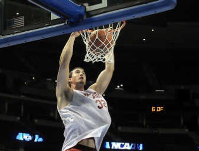 
Washington State's Daven Harmeling gets mile-high during practice Wednesday in Denver. 
 (Christopher Anderson / The Spokesman-Review)