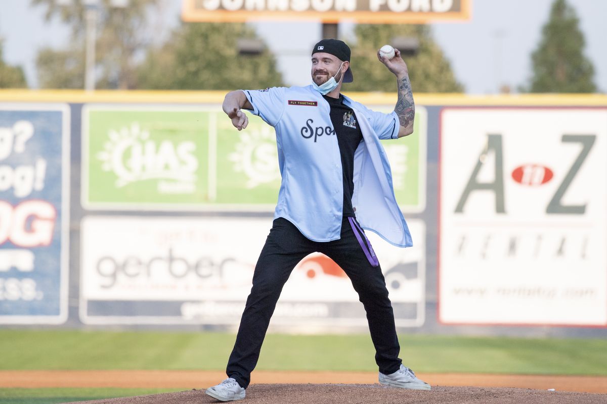Seth Bendewald throws the first pitch at the Spokane Indians game Thursday at Avista Stadium. Bendewald served in the U.S. Army in Afghanistan a decade ago and received a Purple Heart.  (JESSE TINSLEY/THE SPOKESMAN-REVIEW)