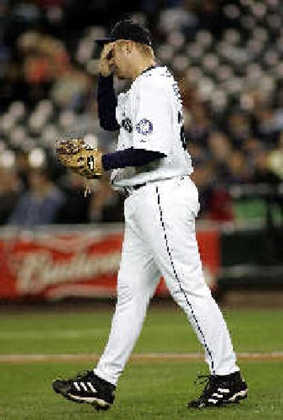 
Mariners reliever J.J. Putz wipes his brow during a disastrous ninth inning.
 (Associated Press / The Spokesman-Review)