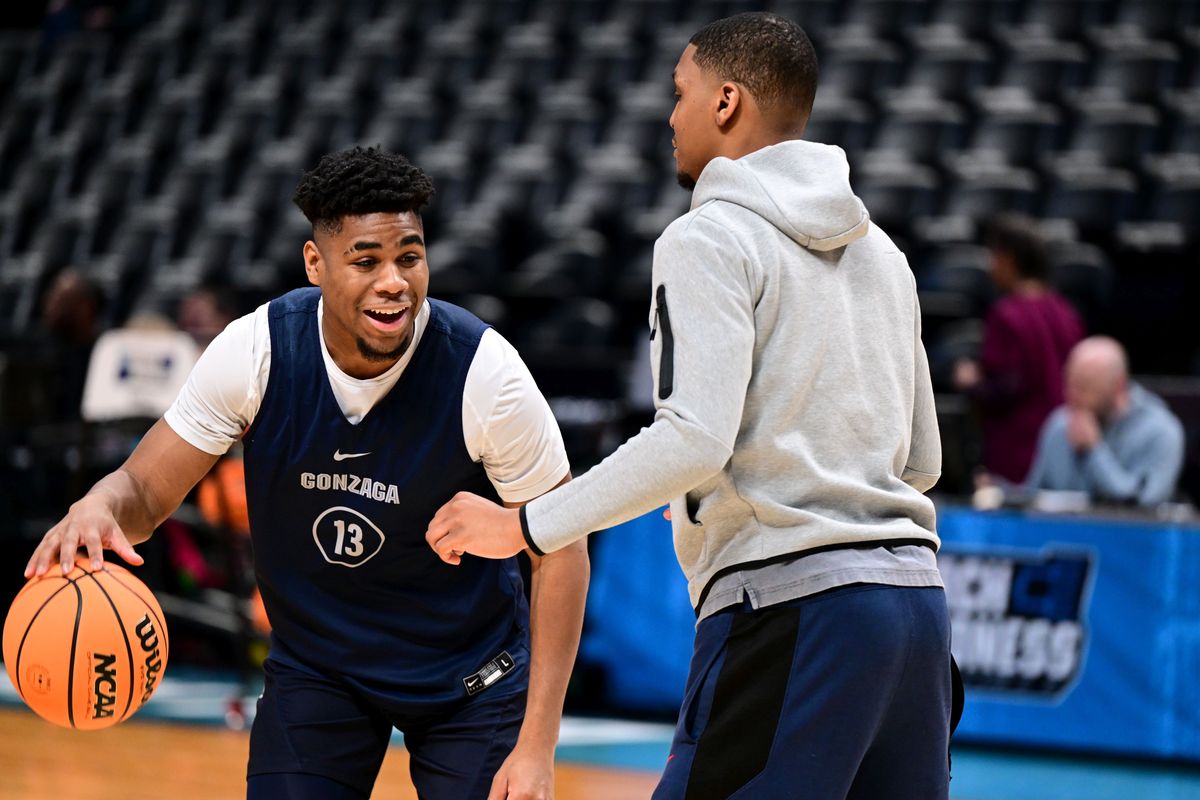 Gonzaga guard Malachi Smith laughs as he works through a drill with former Bulldogs player Zach Norvell Jr. during a practice Thursday before the Zags’ NCAA Tournament opener against Grand Canyon at Ball Arena in Denver.  (Tyler Tjomsland / The Spokesman-Review)