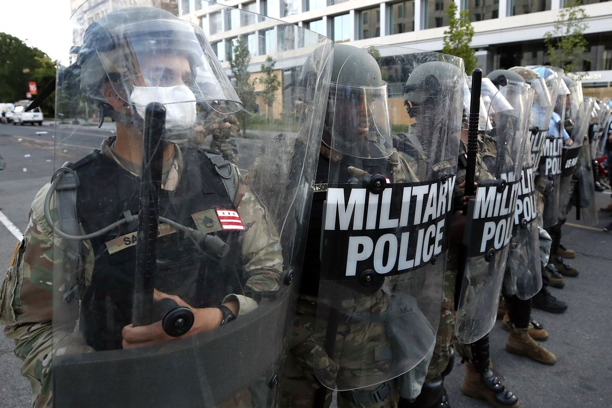 FILE - In this June 1, 2020, file photo police clear the area around Lafayette Park and the White House as demonstrators gather to protest the death of George Floyd in Washington. Floyd died after being restrained by Minneapolis police officers. (Alex Brandon)