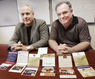 
Alliance Card Inc. Executive Vice President Michael Wheelock, left, and CEO Michael Bouchey display   Cash Value loyalty cards.Associated Press
 (Associated Press / The Spokesman-Review)