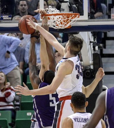 Gonzaga forwards Killian Tillie (33) and Zach Collins defend the rim against Northwestern forward Vic Law during their NCAA second round game, March 18, 2017, in Salt Lake City. A technical foul was called after this play on the Wildcat bench. (Dan Pelle / The Spokesman-Review)