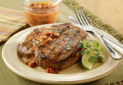 
Grilled Pork Chops with Chipotle Sauce is a quick and savory dish. If you are not ready yet for outdoor grilling, you can easily cook this under the broiler. 
 (Associated Press / The Spokesman-Review)