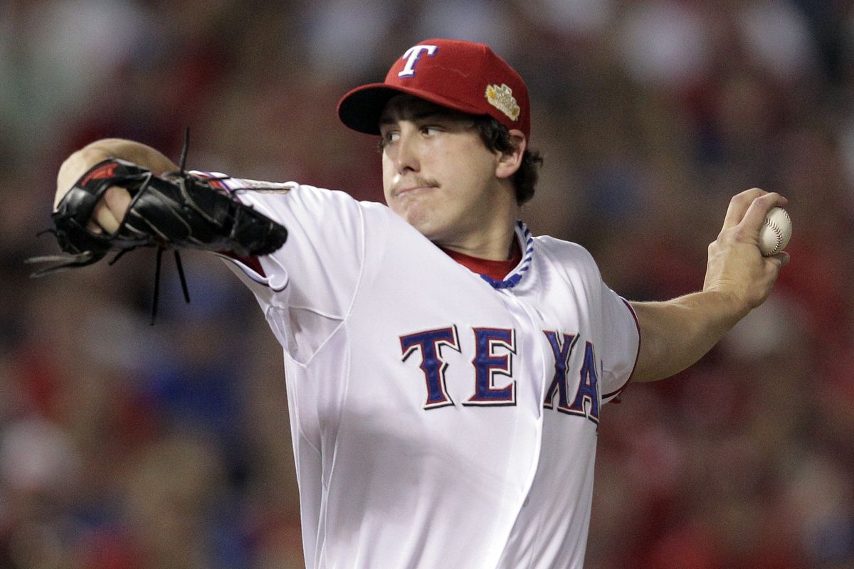 Rangers starter Derek Holland came within two outs of first complete-game Series shutout since 2003. (Associated Press)