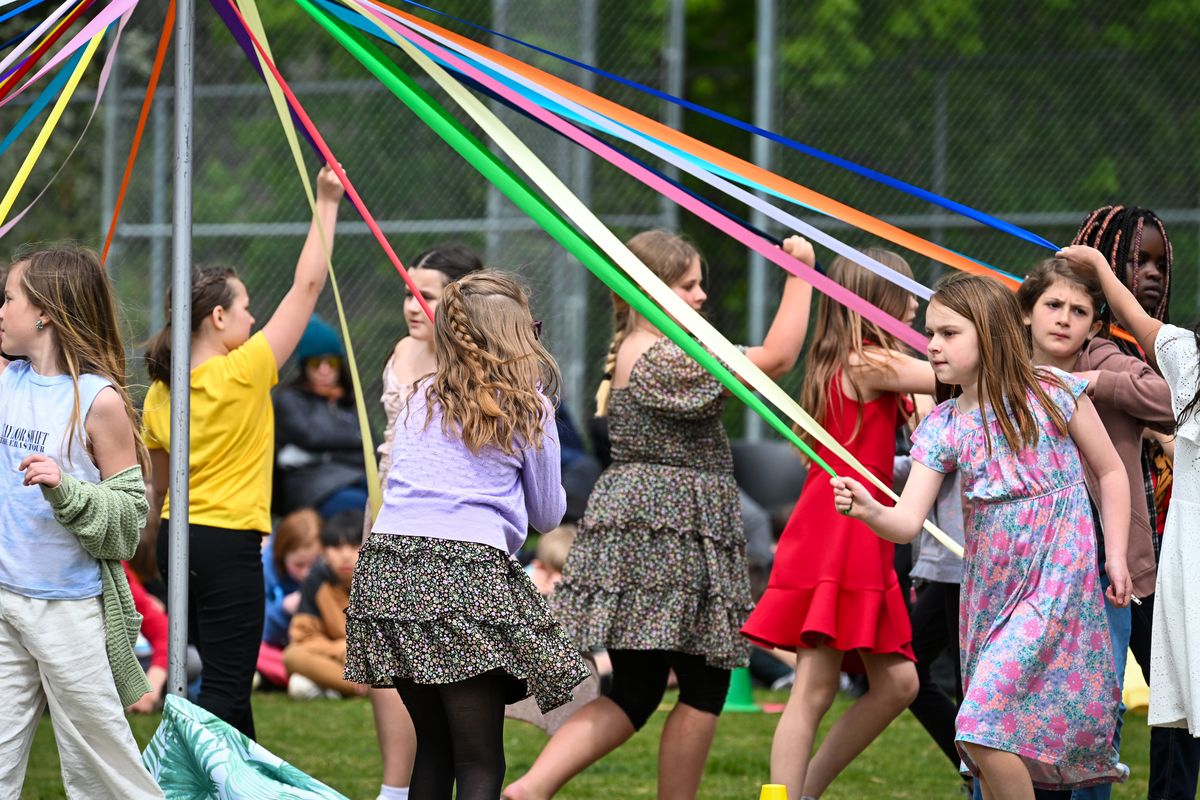 Franklin Elementary School fourth graders weave ribbons around the Maypole as part of their May Day celebration, Wednesday, May 1, 2024, in Spokane.  (DAN PELLE/THE SPOKESMAN-REVIEW)