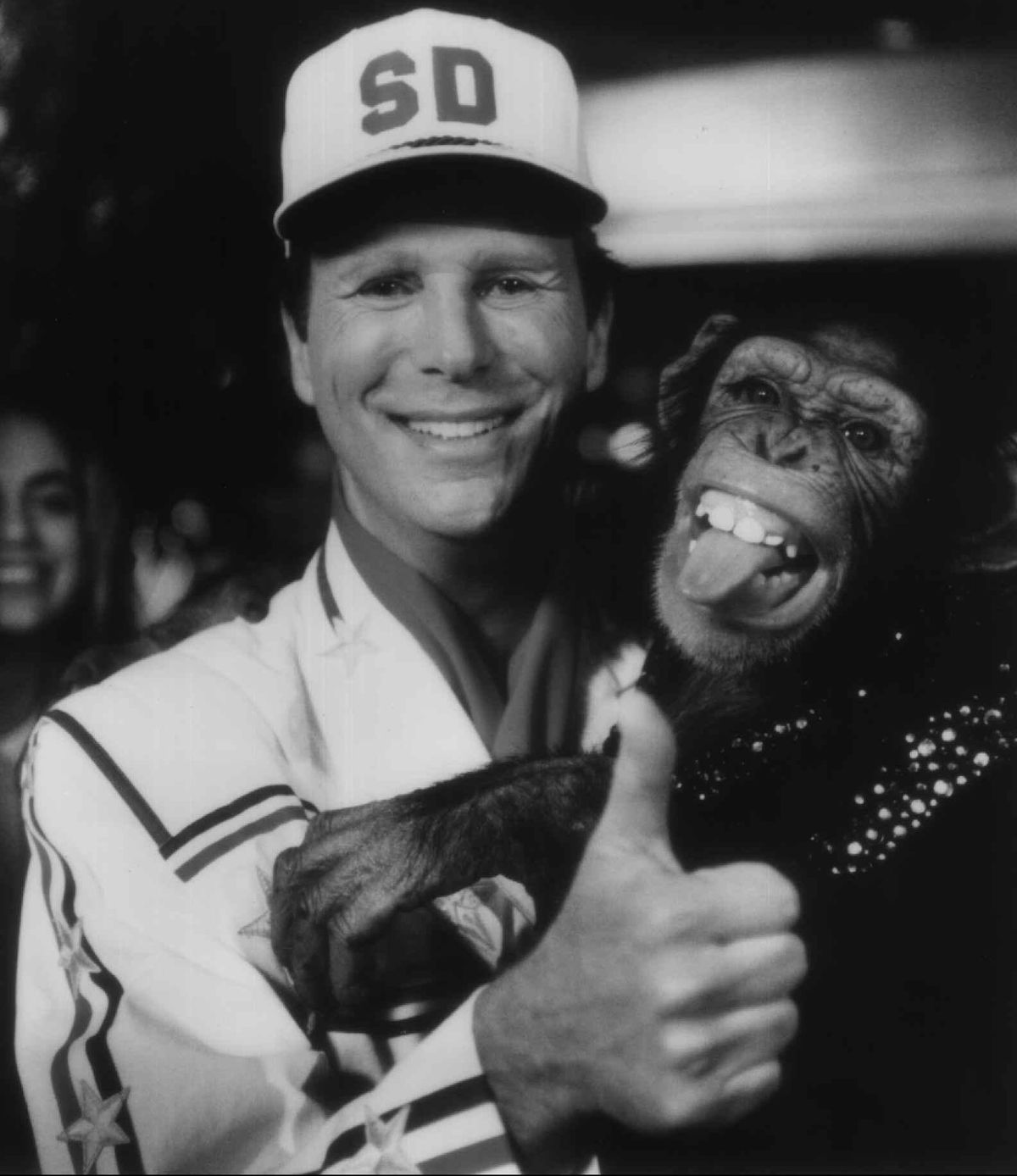 Bob Einstein, as daredevil Super Dave Osborne, poses with a chimp. (Associated Press)