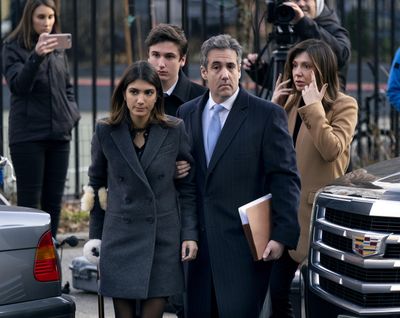 Michael Cohen, second from right, President Donald Trump’s former lawyer, accompanied by his children from left, Samantha and Jake, and his wife Laura Shusterman, right, arrive at federal court for his sentencing for dodging taxes, lying to Congress and violating campaign finance laws in New York on Wednesday, Dec. 12, 2018. (Craig Ruttle / Associated Press)