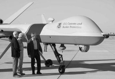 
President  Bush examines an unmanned plane used to monitor for illegal immigrants  at the Yuma Marine Corps Air Station on Monday in Yuma, Ariz. 
 (Associated Press / The Spokesman-Review)