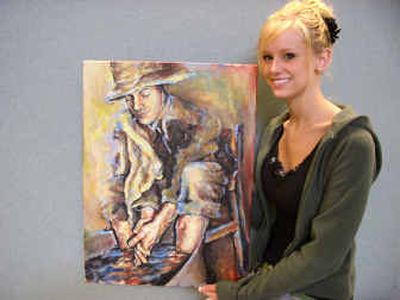 
EVHS senior Kirsten Stobie is pictured with her painting, 