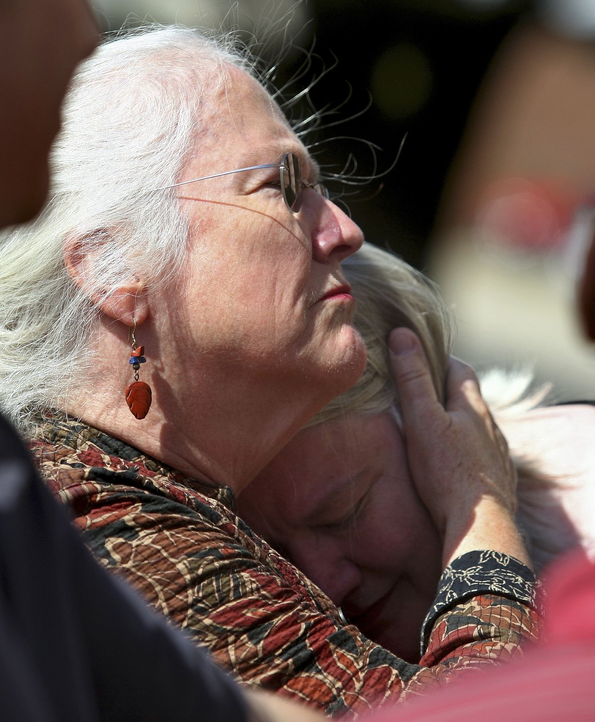 Jeanne Tessier, left, embraces her sister Janet outside the DeKalb County Courthouse in Sycamore, Ill. on Friday, Sept. 14, 2012, following the guilty verdict of their half-brother Jack McCullough for the 1957 kidnapping and murder of 7-year-old Maria Ridulph, of Sycamore. The 72-year-old McCullough was convicted in one of the oldest unsolved crimes to eventually get to court in the U.S. (Kyle Bursaw / Daily Chronicle)