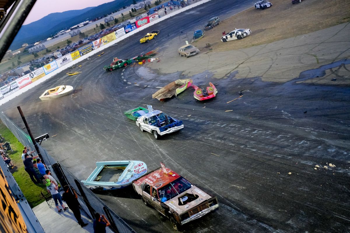 Drivers battle it out during the 2022 Bump to Pass Boat Race on Saturday, July 16, 2022, at Stateline Speedway in Post Falls, Id. Drivers in the Bump to Pass Boat Race tow old fiberglass boat hulls around the track, making contact with rivals in order to advance.  (Tyler Tjomsland/The Spokesman-Review)