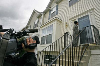 
A reporter knocks on the door of the family residence of Seung-Hui Cho, 23, in Centreville, Va., on Tuesday, a day after the massacre at Virginia Tech. No one answered the door. 
 (Photos by Associated Press / The Spokesman-Review)