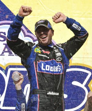 Jimmie Johnson celebrates after winning the NASCAR race at Talladega on Sunday, his first victory of the year. (Associated Press)